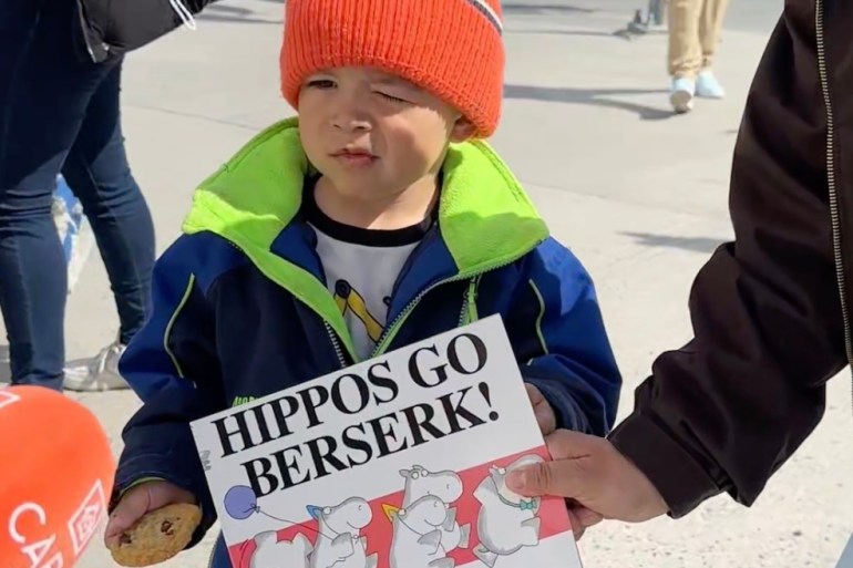 A young reader in Yellowknife on May 13, 2025. Andrew Goodwin/Cabin Radio